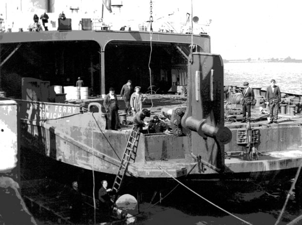 Norfolk Ferry alongside Parkeston Qay in 1969 having a damaged rudder replaced by the Port Workshops with the ferry still afloat