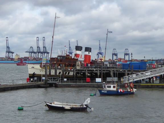A modern photograph of Halfpenny Pier with the 693 gross ton Waverley alongside
